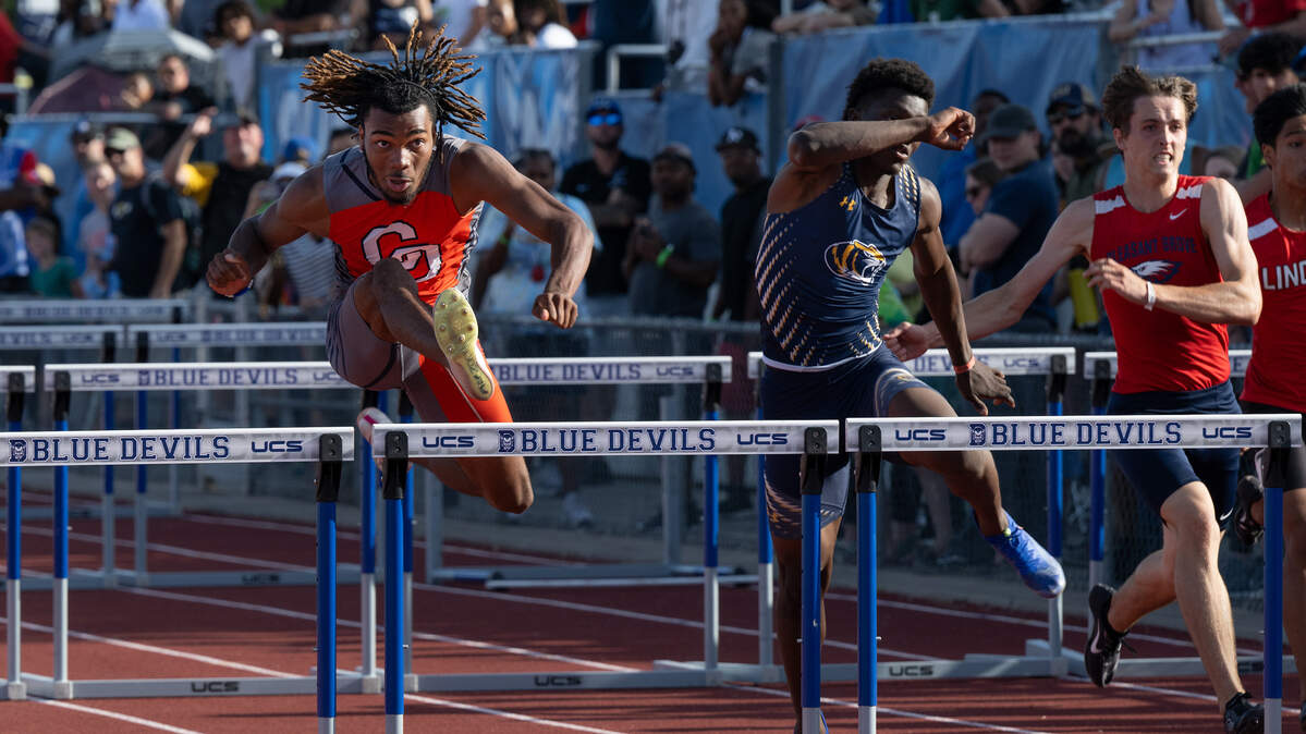 Cosumnes Oaks’ Myles McFarland, left, won the boys 110-meters hurdles at the CIF Sac-Joaquin Section Masters meet Saturday at Davis High School. Rickey Green III of Inderkum, middle, placed second and Pleasant Grove’s Matthew McHale, right, was third.