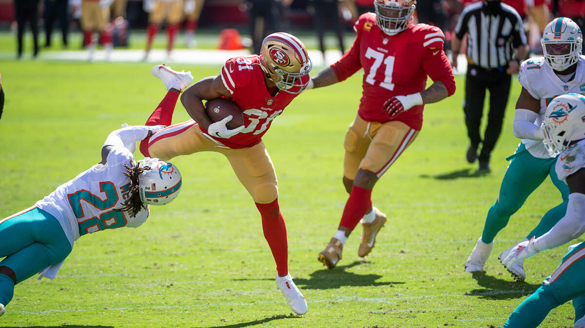 San Francisco 49ers running back Raheem Mostert (31) is tripped up by Miami Dolphins strong safety Bobby McCain (28) in the first quarter during a game at Levi’s Stadium on Sunday, Oct. 11, 2020 in Santa Clara.