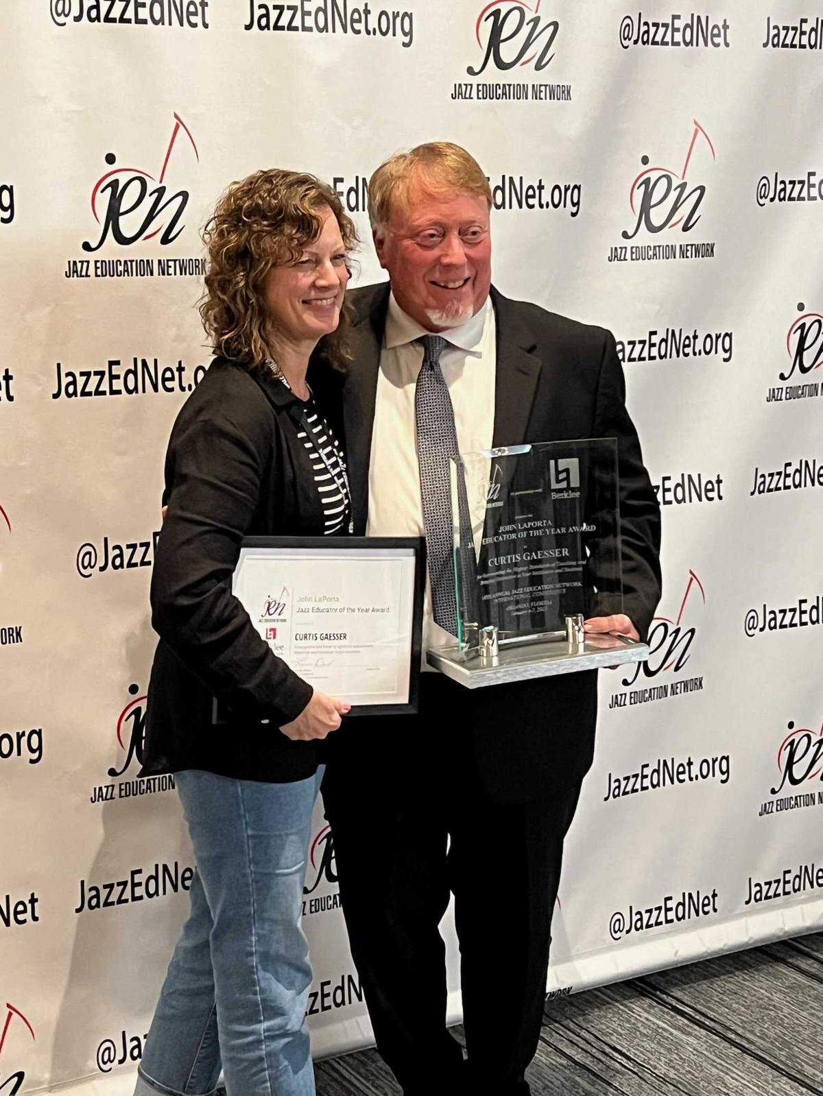 Lisa Gaesser, left, poses with her husband, Curtis Gaesser, after he received the John LaPorta Jazz Educator of the Year award, a national award recognizing an elementary, middle, or high school educator with a focus on jazz education on Jan. 6, 2023. Gaesser said he retires at the end of the 2022-2023 school year because he is “tired inside” and wants to spend time with his wife.