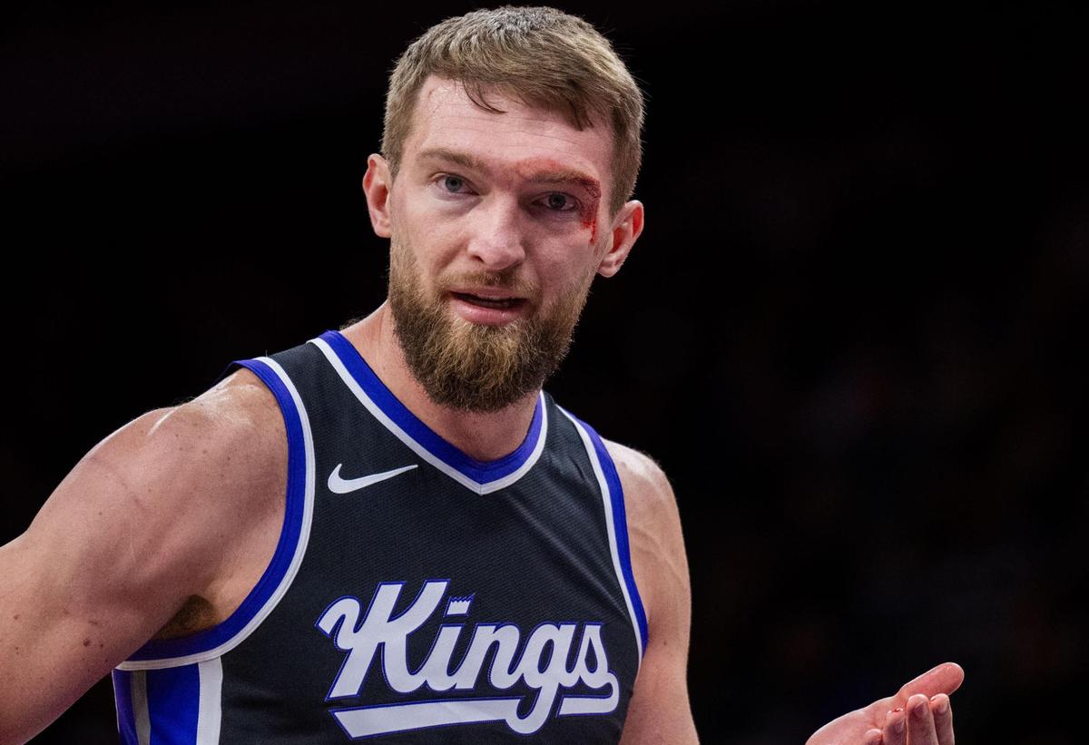 Blood flows from a large cut above the eye of the Sacramento Kings’ Domantas Sabonis (11), the result of an elbow thrown by Oklahoma City Thunder forward Adam Flagler, during an NBA game on Monday at Golden 1 Center.