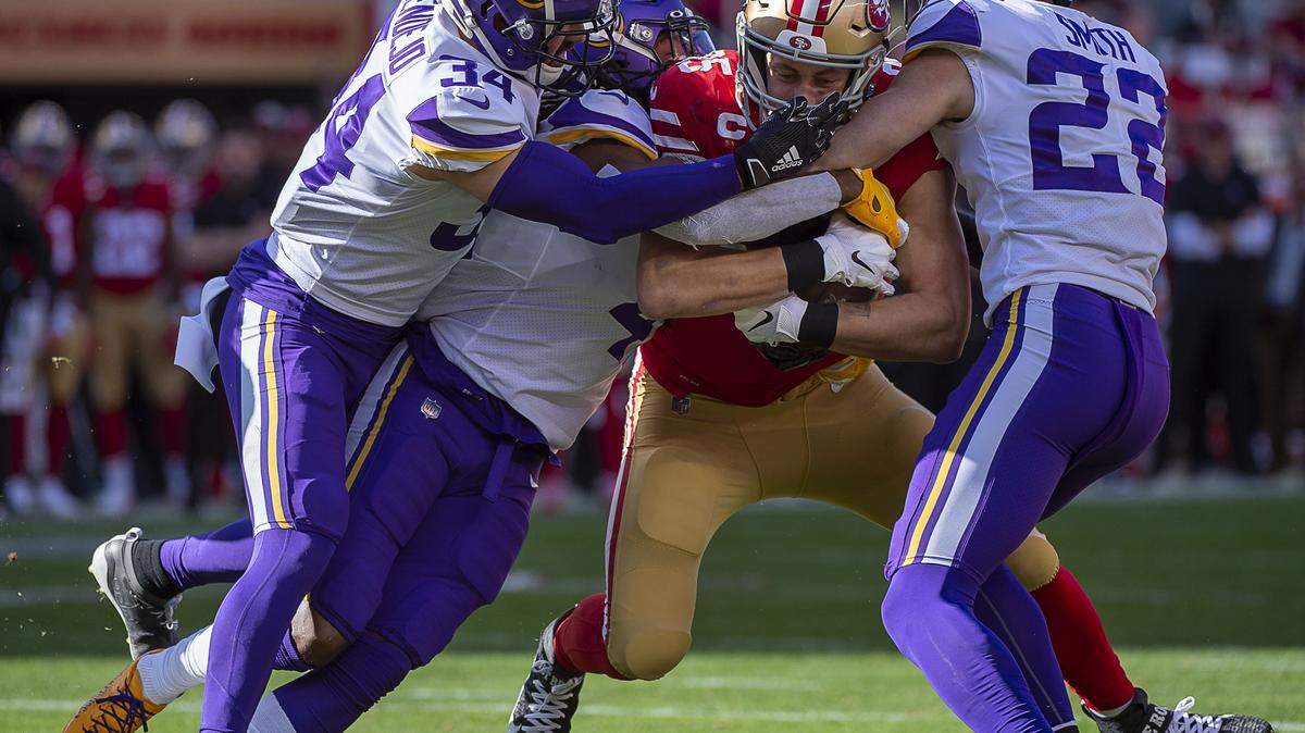 San Francisco 49ers tight end George Kittle (85) is tackled by Minnesota Vikings strong safety Andrew Sendejo (34), Minnesota Vikings free safety Harrison Smith (22) and Minnesota Vikings defensive back Anthony Harris (41) in the first quarter during an NFC playoff game at the Levi’s Stadium on Saturday, Jan 11, 2020 in Santa Clara.
