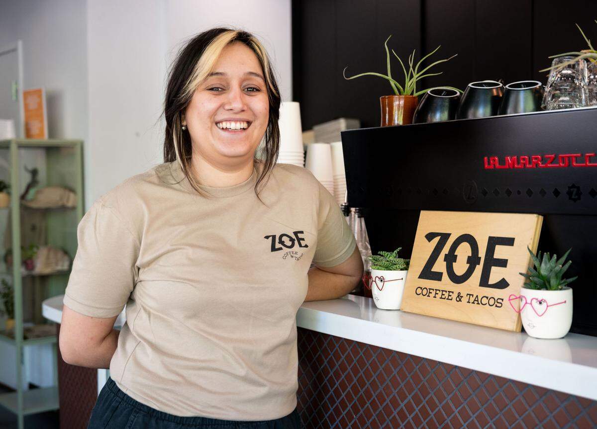 Angelika Basurto manages Zoe Coffee and Tacos in Sacramento on Tuesday. “To most people, it seems unusual, but for Jose and I, who grew up in Latin households, that’s standard,” she said.