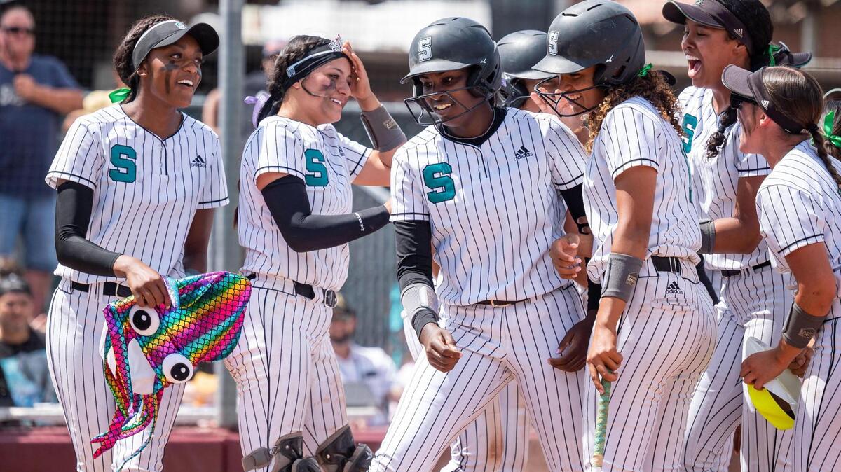 Sheldon’s Dakota Kennedy, center, is congratulated at the plate after hitting a homer against Lincoln in the bottom of the fifth inning at the Sac-Joaquin Section Division I high school softball championship game Saturday, May 28, 2022, at Sacramento City College. Sheldon beat Lincoln, of Stockton, 7-1.