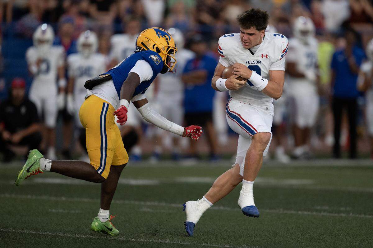 The Grant Pacers’ Savion Bandy (9) runs down Folsom Bulldogs quarterback Ryder Lyons (3), who had lost his helmet, in the first half on Friday, Aug. 23, 2025, in Del Paso Heights.