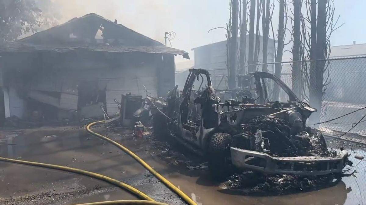 A fire burned a house and about a dozen cars in North Sacramento’s Robla neighborhood on Monday.