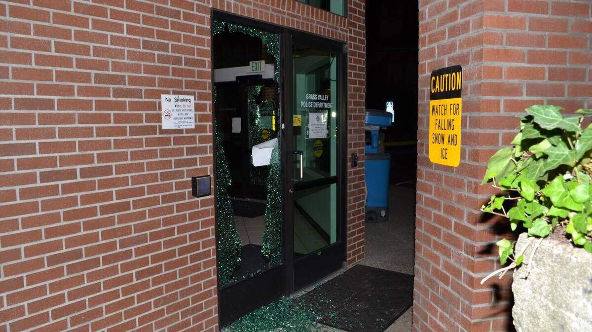 The Grass Valley Police Department is searching for a suspect who threw a rock through the lobby door.