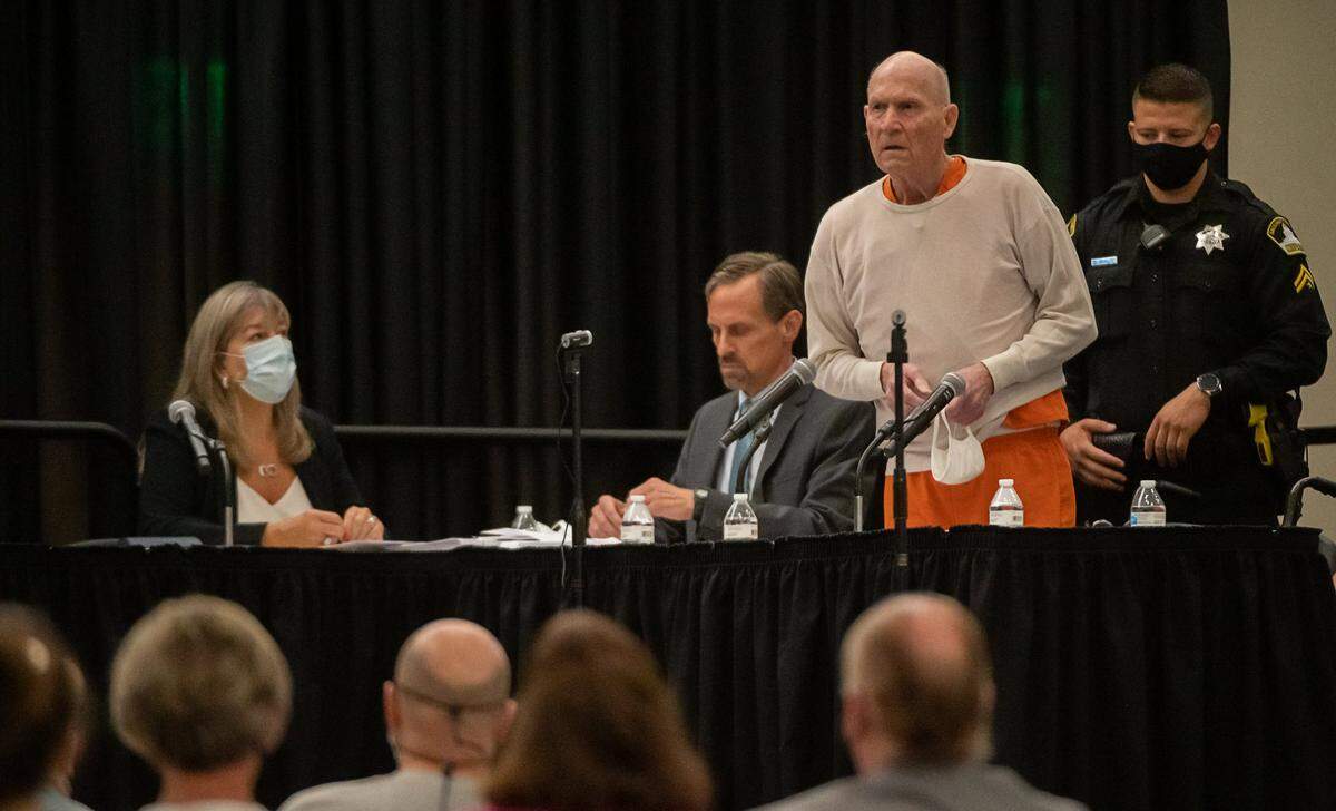 Golden State Killer/East Area Rapist Joseph James DeAngelo stands and apologizes to his victims and their families in a makeshift Sacramento Superior Courtroom at Sacramento State University on Friday, Aug. 21, 2020. He was sentenced to life in prison without the possibility of parole for 13 murders and a host of rapes and other crimes.