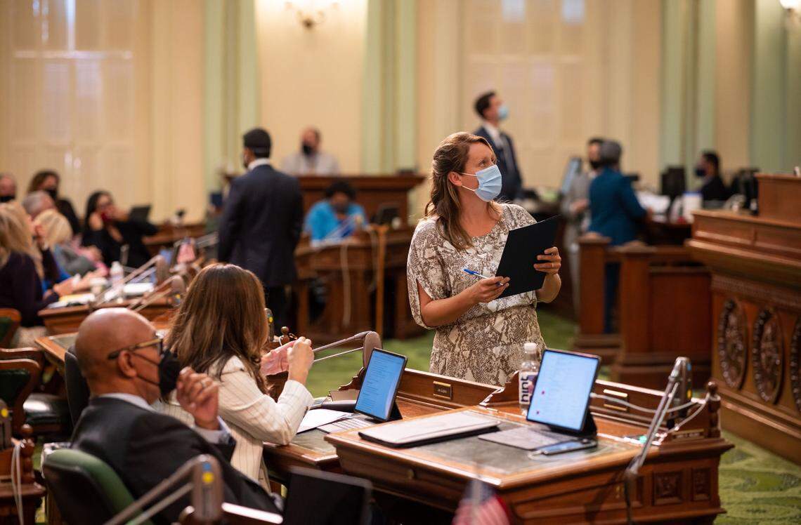State Assemblywoman Buffy Wicks, D-Oakland, looks up during a vote in the Capitol in September 2021. Wicks has faced tough negotiations with construction labor unions over housing legislation.
