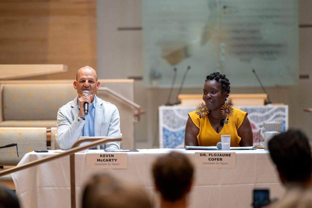 Sacramento mayoral candidates Kevin McCarty and Flojaune Cofer answer questions at a forum hosted by Black, Latino and Jewish organizations at Congregation B’nai Israel on Sunday.