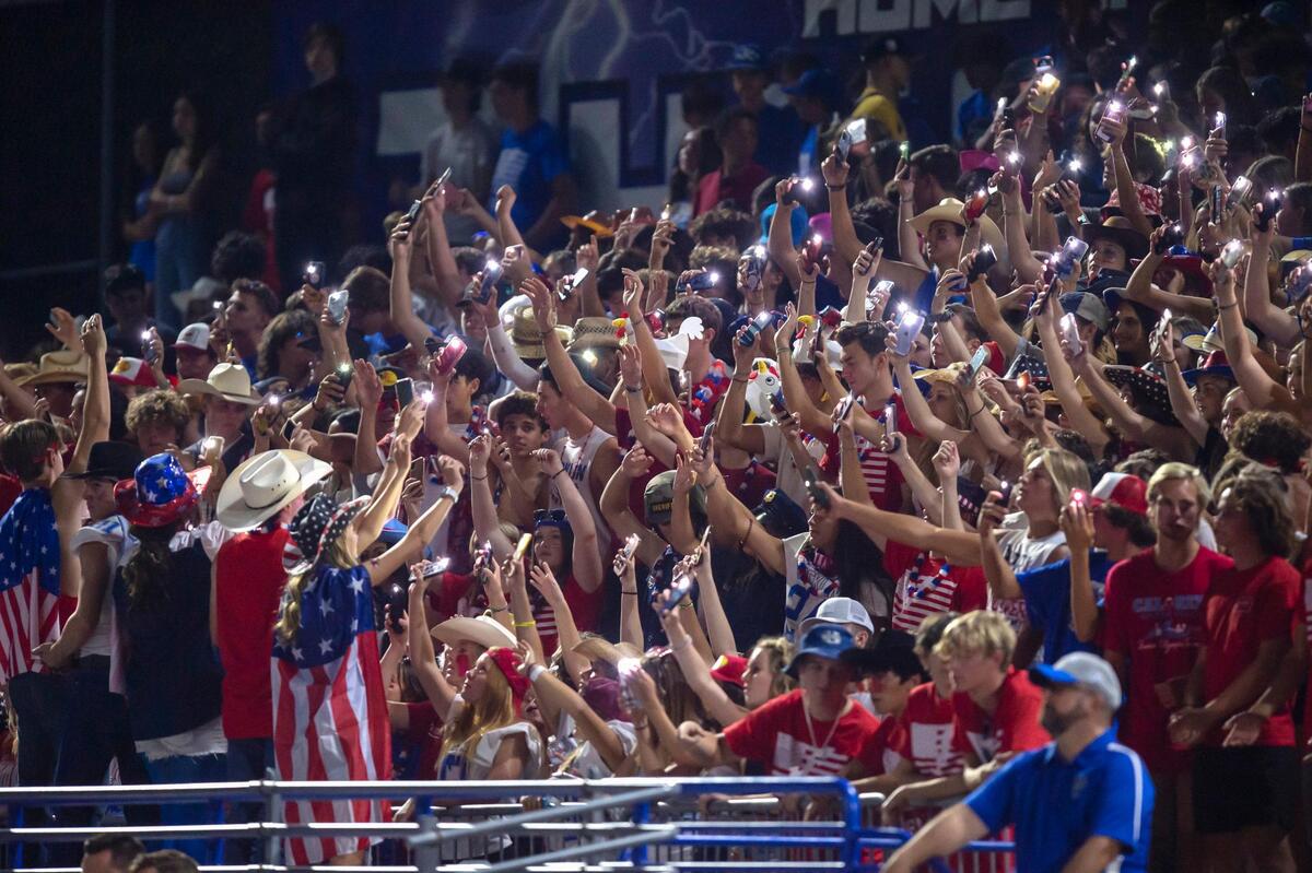 Rocklin Thunder fans cheer on their team with lit cell phones during the game at Rocklin High School in Rocklin on Friday, Sept. 24, 2021. Rocklin won 38-3.