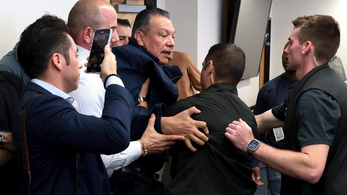 Sen. Alex Padilla is removed from the room after interrupting a news conference with Department of Homeland Security Secretary Kristi Noem at the Wilshire Federal Building in Los Angeles on June 12, 2025.