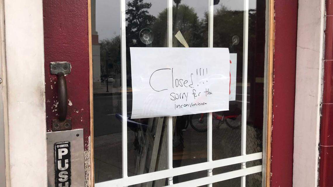 A sign on the door at Dad’s on J, a popular sandwich shop, marks its closure. The restaurant will reopen as a falafel shop, said new owner Saif Aslam.