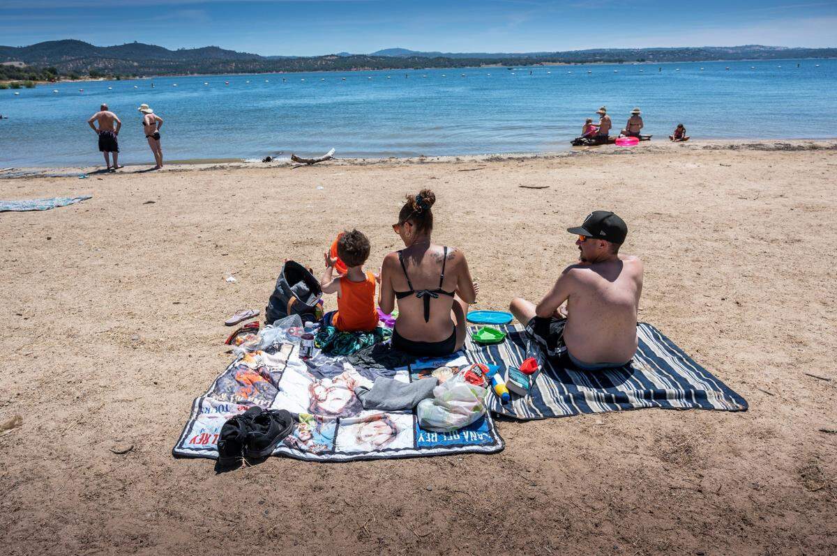 Three-year-old Roger Williams, of Citrus Heights, enjoys the morning at Folsom Lake on Thursday, June 9, 2022, with his parents Rayna and Roger.