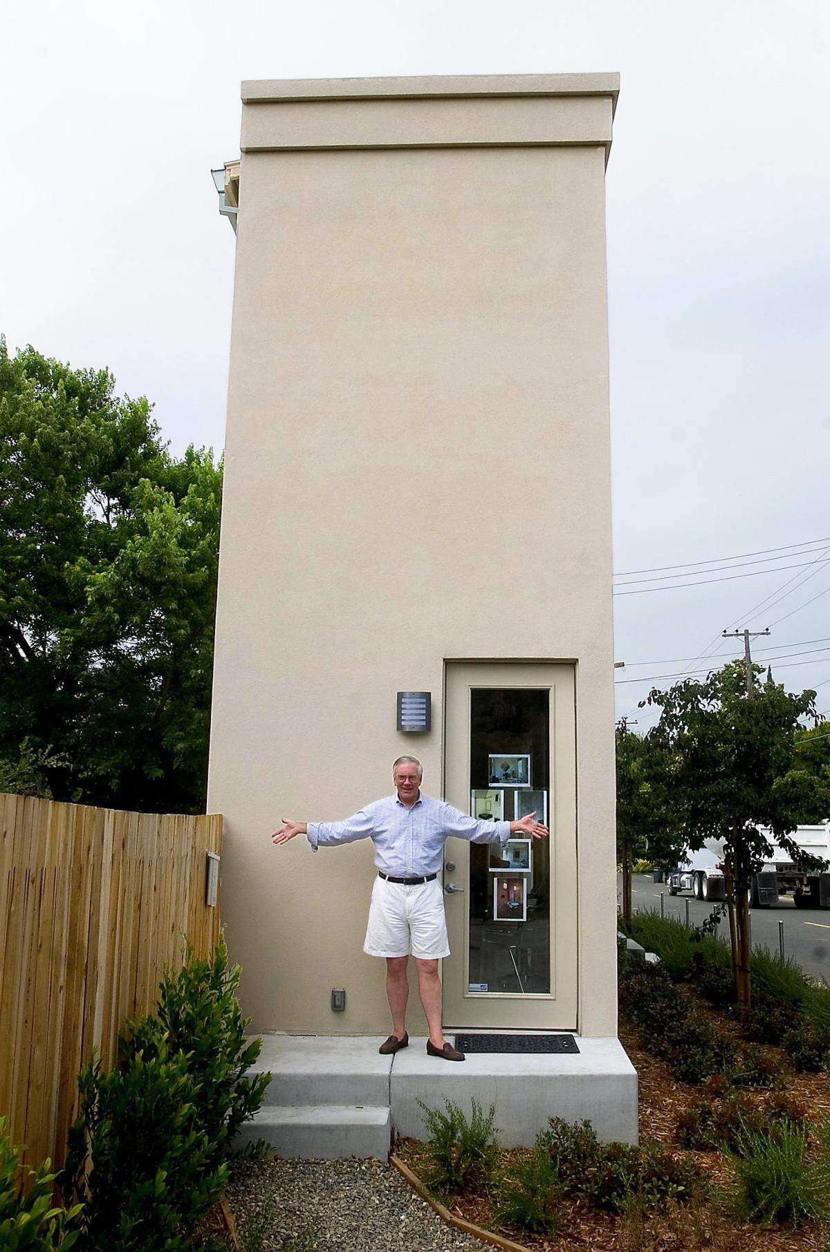 John Johnston, builder of the Skinny House, stands in front of the south side of his narrow Sacramento home in 2006.