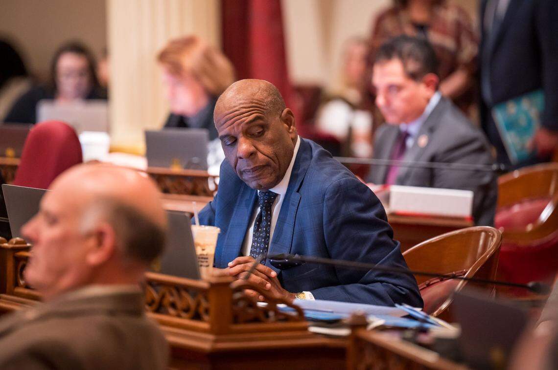 State Sen. Steven Bradford, D-Gardena, listens to conversation in the Senate chamber at the state Capitol on the final day of the 2023 legislative session.