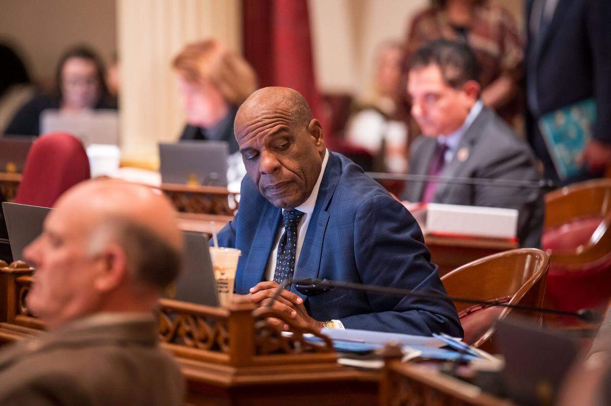 State Sen. Steven Bradford, D-Gardena, listens to conversation in the Senate chamber at the state Capitol on Thursday, Sept. 14, 2023, the final day of the legislative session.