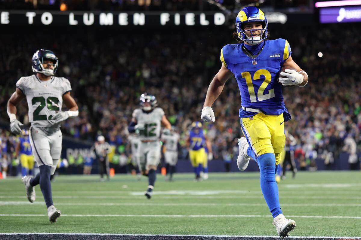 SEATTLE, WASHINGTON - DECEMBER 18: Puka Nacua #12 of the Los Angeles Rams scores a touchdown during overtime against the Seattle Seahawks at Lumen Field on December 18, 2025 in Seattle, Washington. (Photo by Steph Chambers/Getty Images)