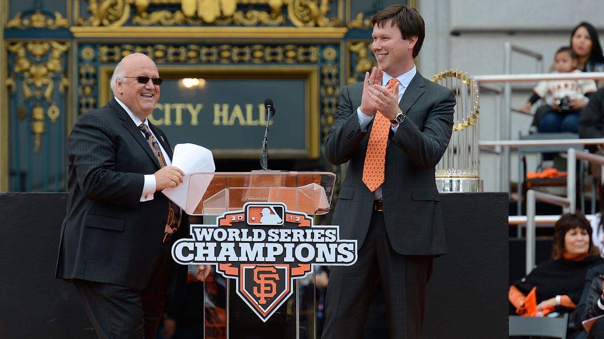 San Francisco Giants broadcasters Jon Miller, left and Dave Flemming celebrate onstage during the Giants' World Series victory parade and celebration on Oct. 31, 2012, in San Francisco.