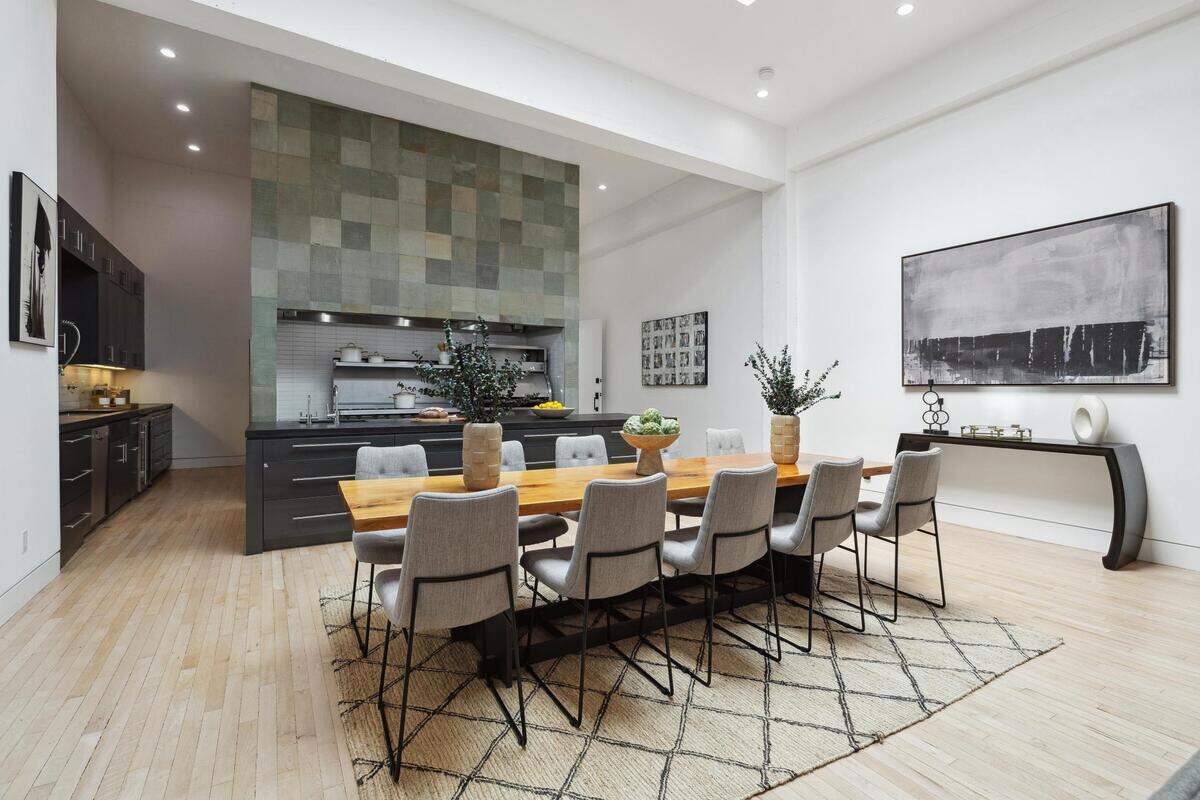 A spacious farm dining room adjacent to a commercial-grade kitchen allows “for a blend of both preparation and enjoyment of the food.”