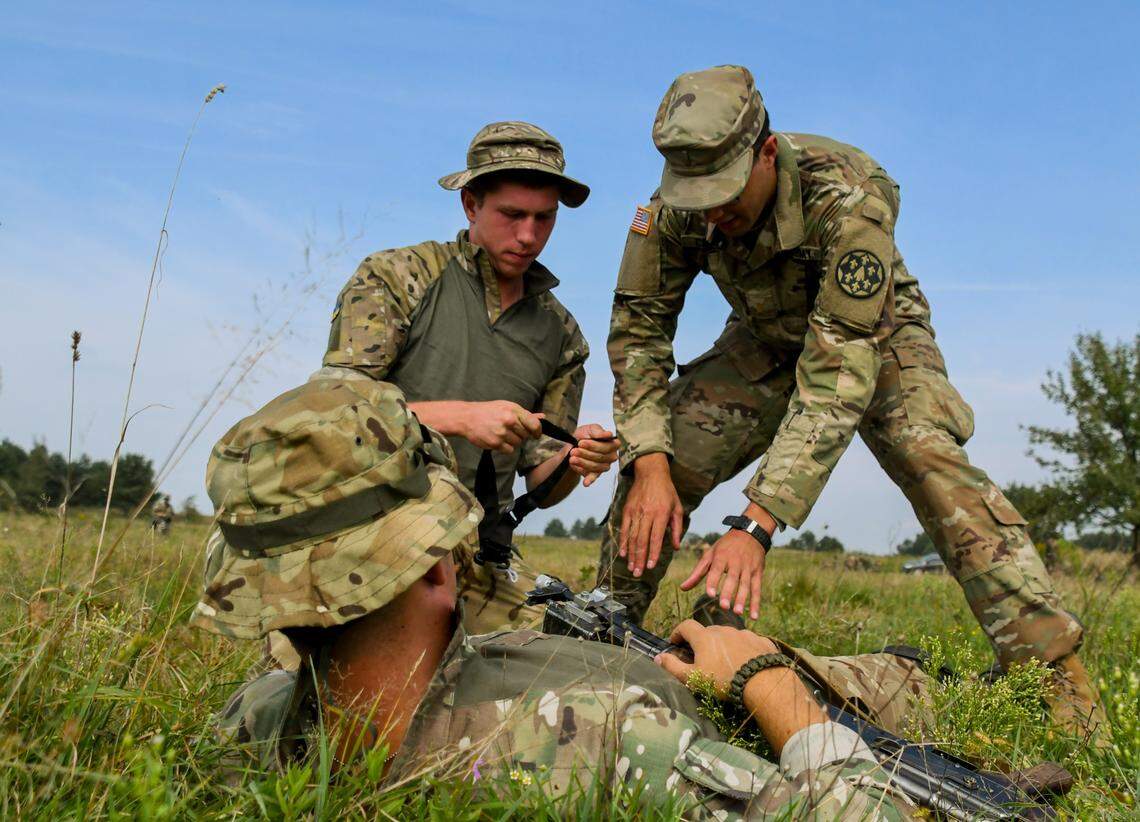 Second Lt. Collins of the California National Guard works with Bulgarian soldiers to train Ukrainian troops on medical evacuation in Yavoriv, Ukraine, in 2018.