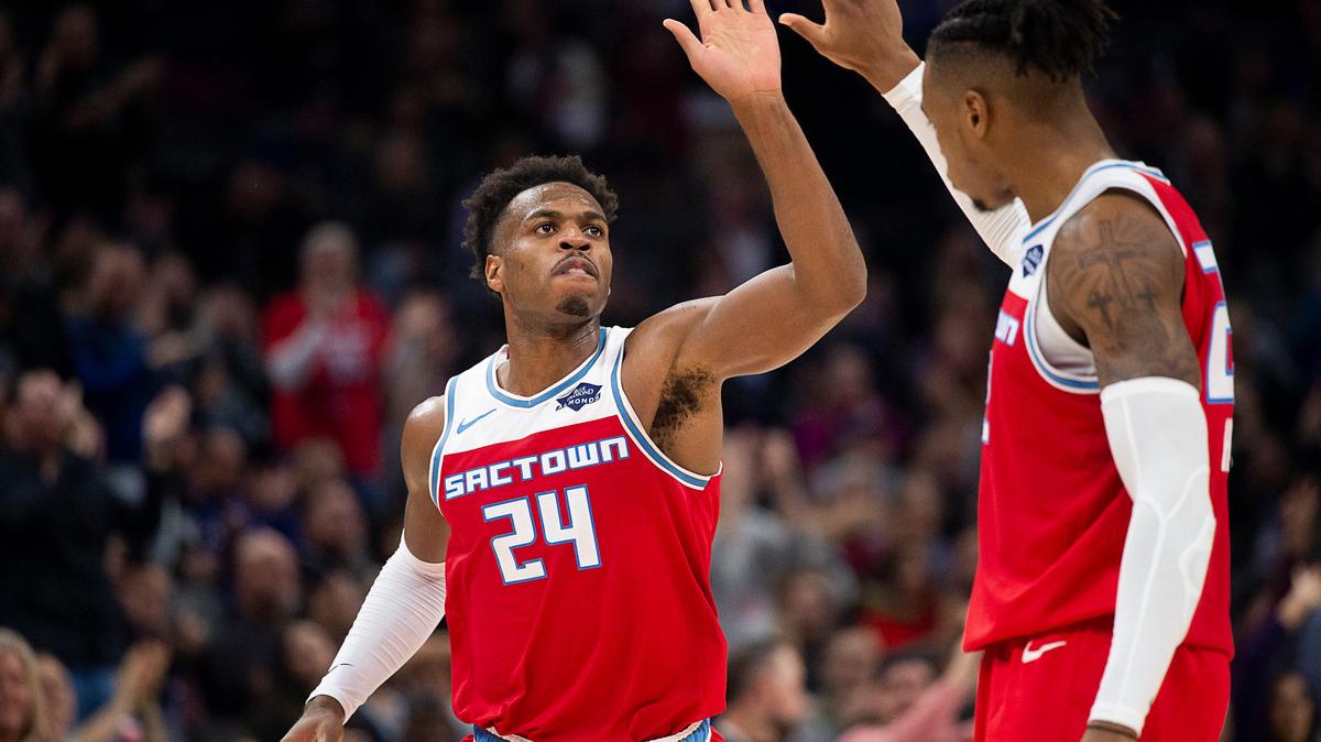 Sacramento Kings guard Buddy Hield (24) celebrates basket with Sacramento Kings forward Richaun Holmes (22) during a game at Golden 1 Center on Wednesday, December 11, 2019 in Sacramento.