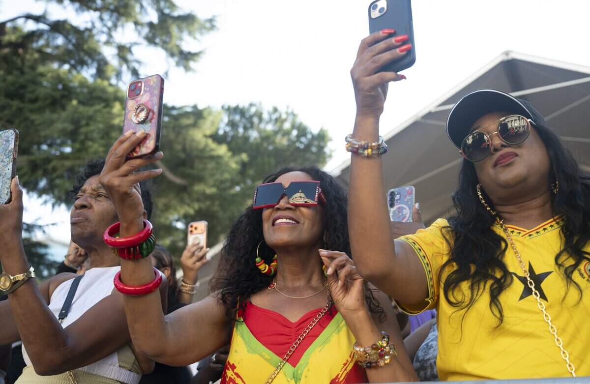 Concert attendees use their cellphones to record singer Goapele’s performance Wednesday.
