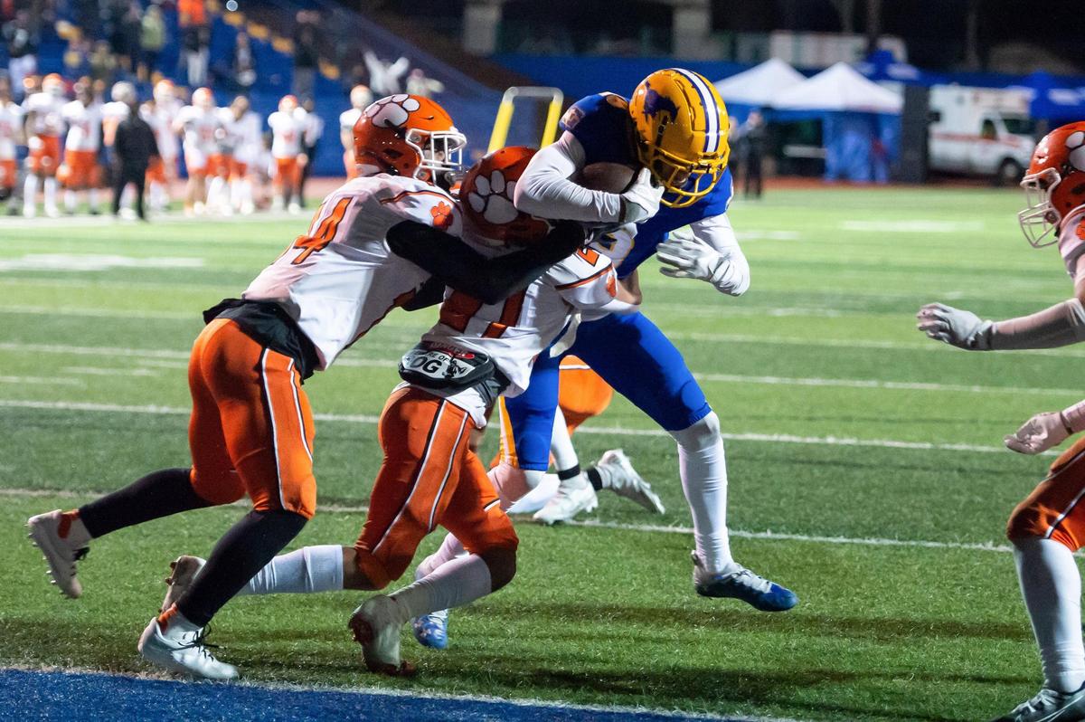 The Grant Pacers’ Kyle Ryan (19) battles to get into the end zone to score the Pacers’ final touchdown against San Jacinto with under a minute left in the fourth quarter in the 2022 CIF State Division III-AA Football Championship on Saturday, Dec. 10, 2022, at Grant High School in Sacramento. The Pacers won 36-34.