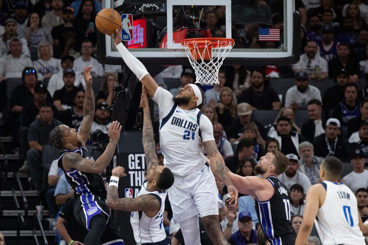 Dallas Mavericks center Daniel Gafford (21) blocks shot by Sacramento Kings forward DeMar DeRozan (10) during an NBA play-in game at Golden 1 Center on Wednesday, April 16, 2025, in Sacramento. 