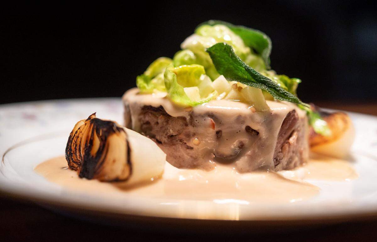 Restaurant Josephines pork and baby onion dish is photographed Tuesday, Sept. 21, 2021, in Auburn.