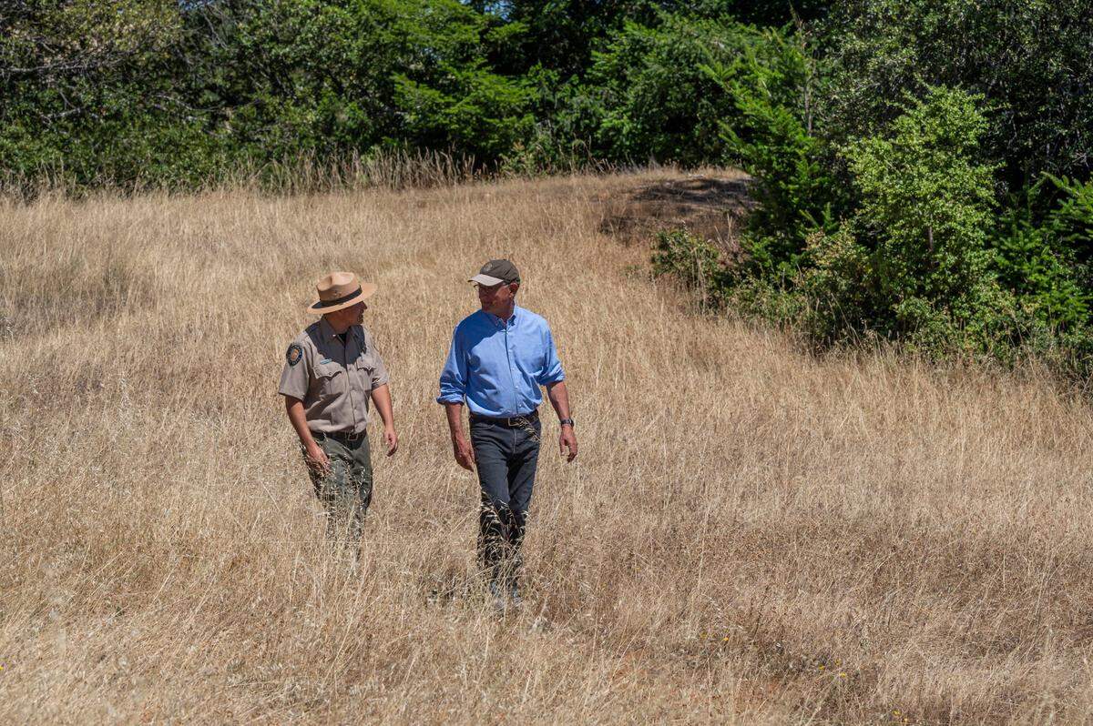 California State Parks Bay Area district superintendent Matthew Allen, left, walks with parks Director Armando Quintero on July 15 at Mount Tamalpais State Park. When Quintero started his parks career in 1997 with the National Park Service, he faced constant reminders of being a Latino in an overwhelmingly white profession. The parks system still has a long way to go in creating a workforce that reflects the California’s diversity.