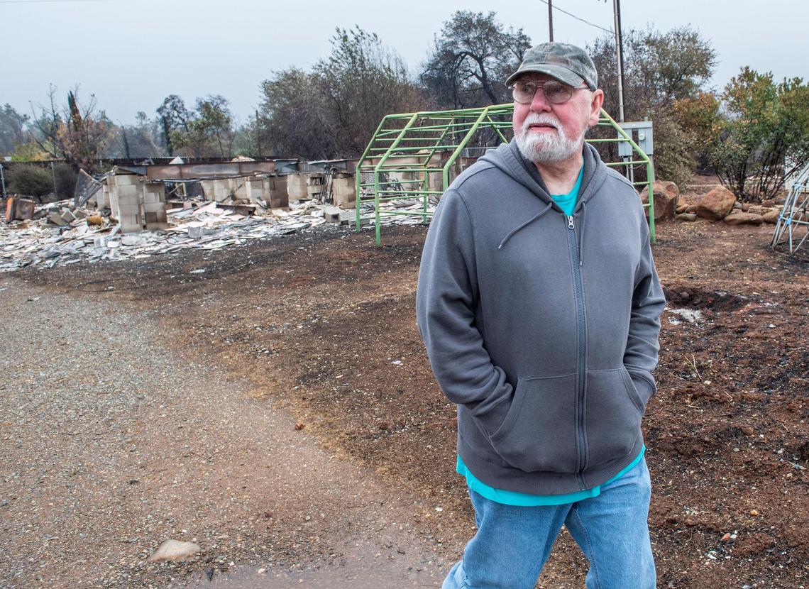 William Hammond walks on his burned down property on Neal Road on Thursday, Nov. 22, 2018.