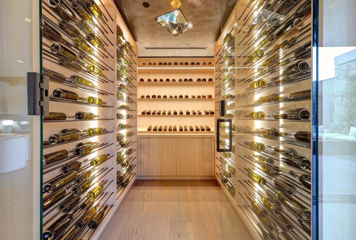 A temperature-controlled wine cellar and 1.5 acres of Cabernet Sauvignon vines make this property a true haven for wine enthusiasts.