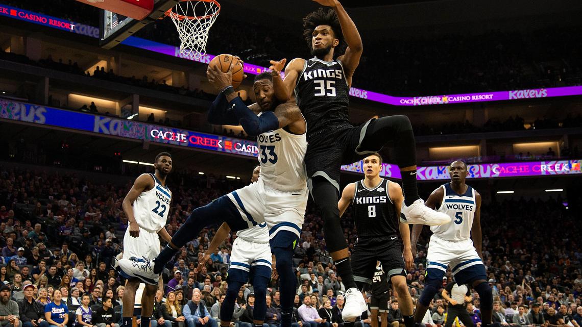 Sacramento Kings forward Marvin Bagley III (35) battles Minnesota Timberwolves forward Robert Covington (33) for rebound during a game at Golden 1 Center on Thursday, Dec 26, 2019 in {city.}