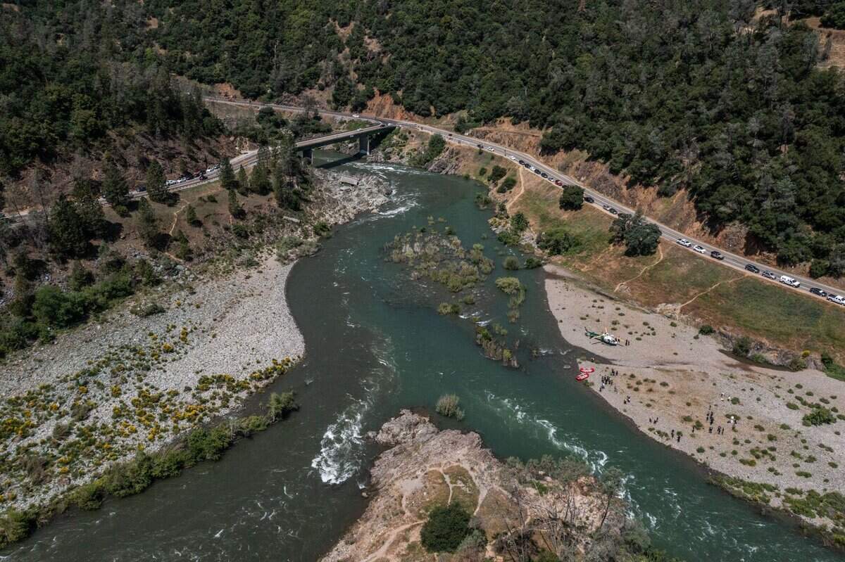 The confluence of the north and middle forks of the American River is swollen with record snow melt on Wednesday, as first responders from the Placer County Sheriff’s Office, Cal Fire and California State Parks demonstrate the challenges of river rescue.