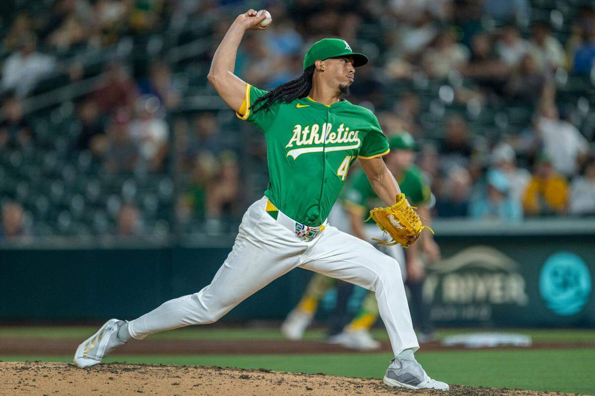 Athletics pitcher Osvaldo Bido (45) throws a pitch during the sixth inning of a game against the Toronto Blue Jays at Sutter Health Park in West Sacramento on Friday, July 11, 2025.