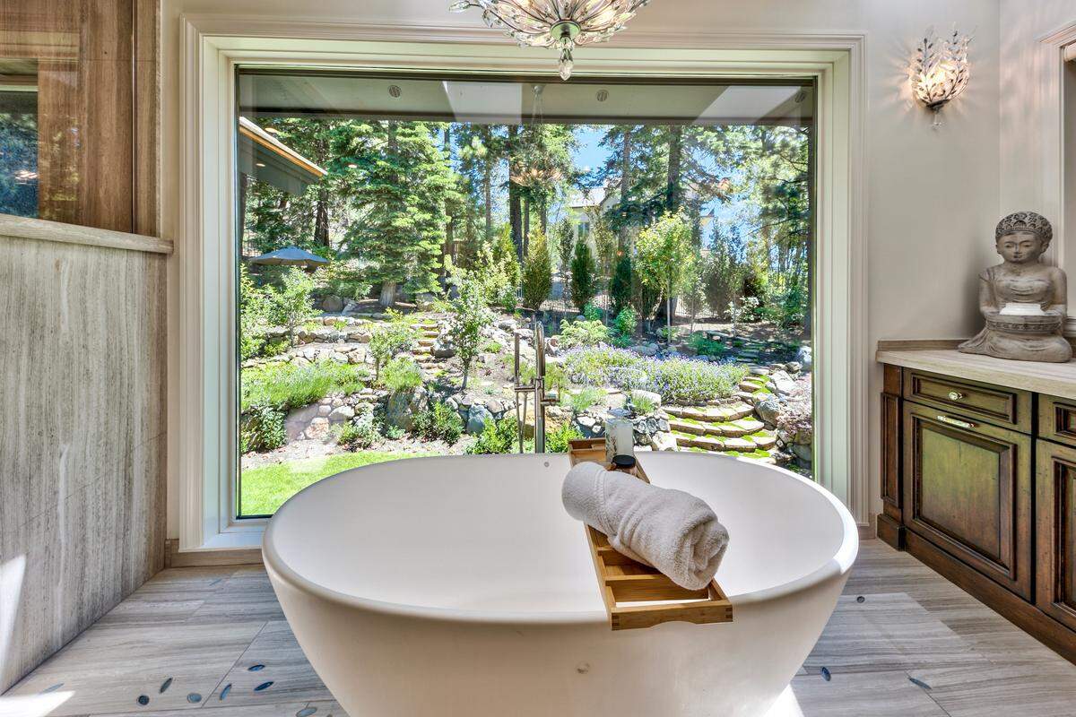 Inside 708 Champagne Road, every detail exudes craftsmanship and elegance, from hand-carved millwork and custom ironwork to imported stone in the five plush bedrooms and seven lavish baths.