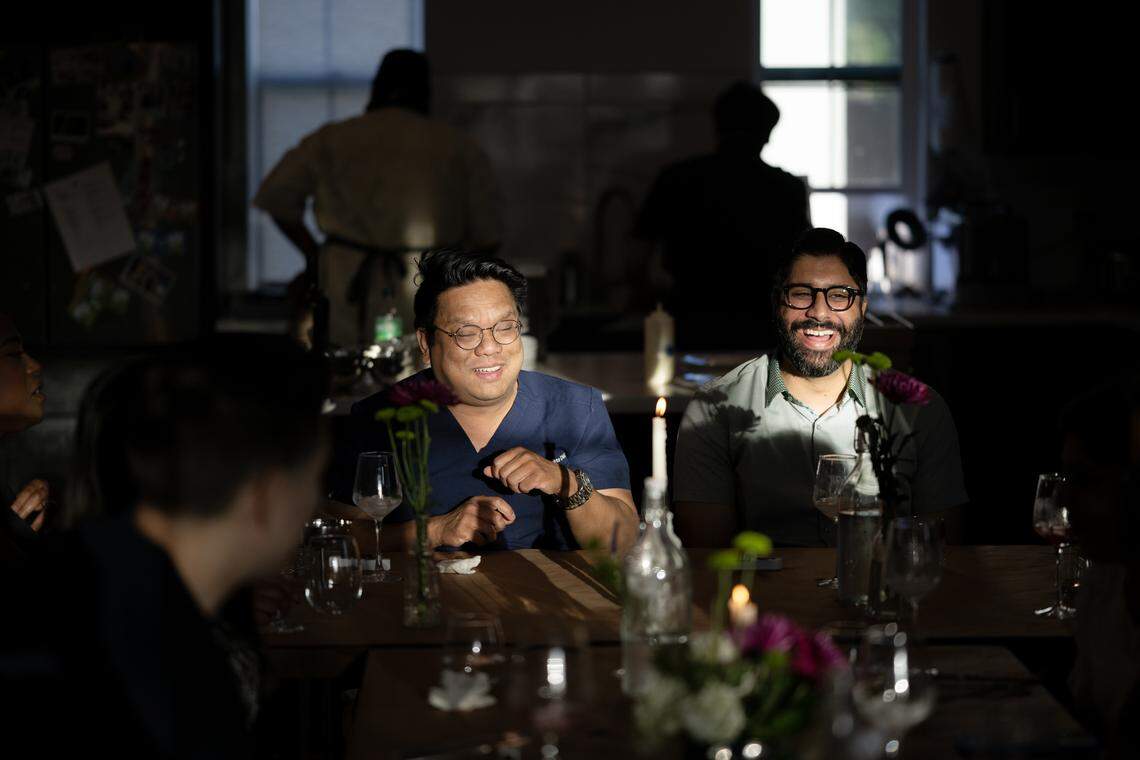 Raymond Bautista, left, and Jeevan Bhungal enjoy dinner catered by Chef Eríc Martínez of the Crispín Supper Club on Friday, April 24, 2026, in Sacramento.