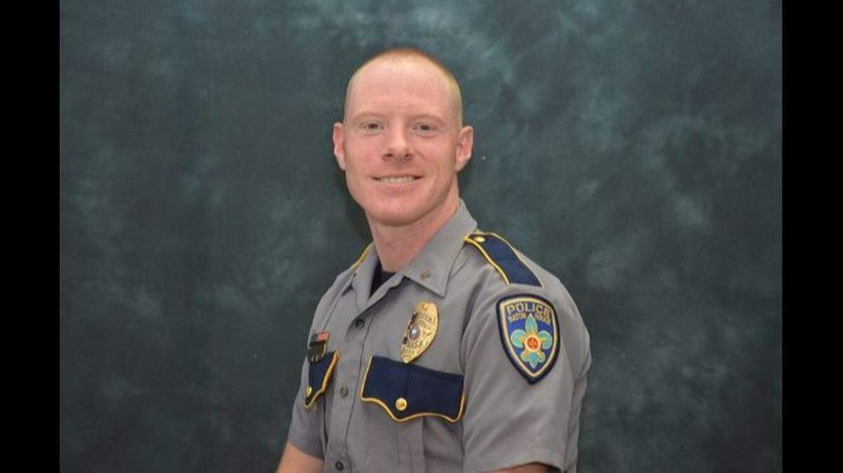 Cpl. Shane Totty, 31, died Friday after a motorcycle crash during a funeral procession in Baton Rouge, Louisiana, police say. A new father, Totty had survived being shot in the face in 2018.