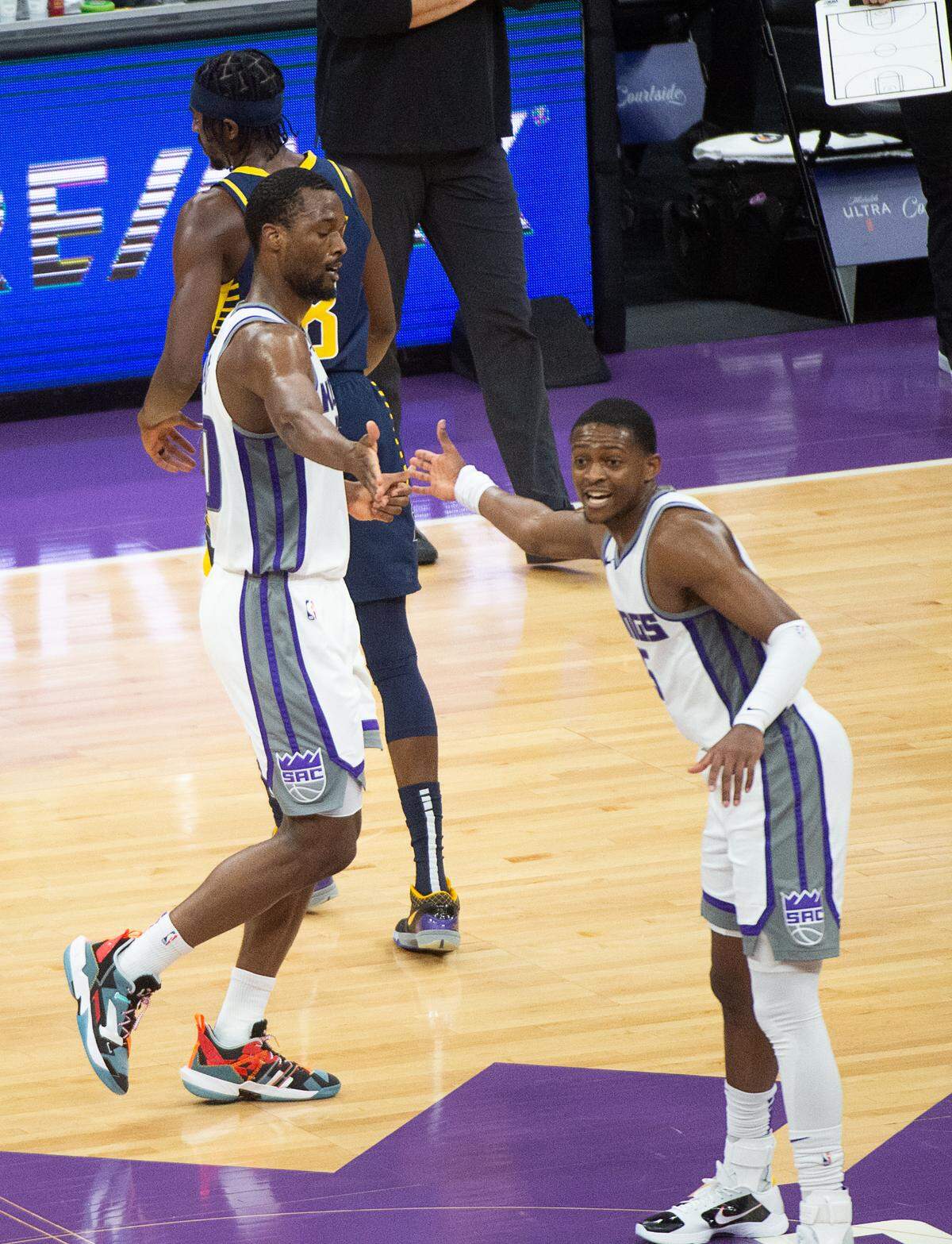 Sacramento Kings forward Harrison Barnes (40) and Sacramento Kings guard De’Aaron Fox (5) celebrate after a basket during a game against the Indiana Pacers at the Golden 1 Center on Monday, Jan 11, 2021 in Sacramento.