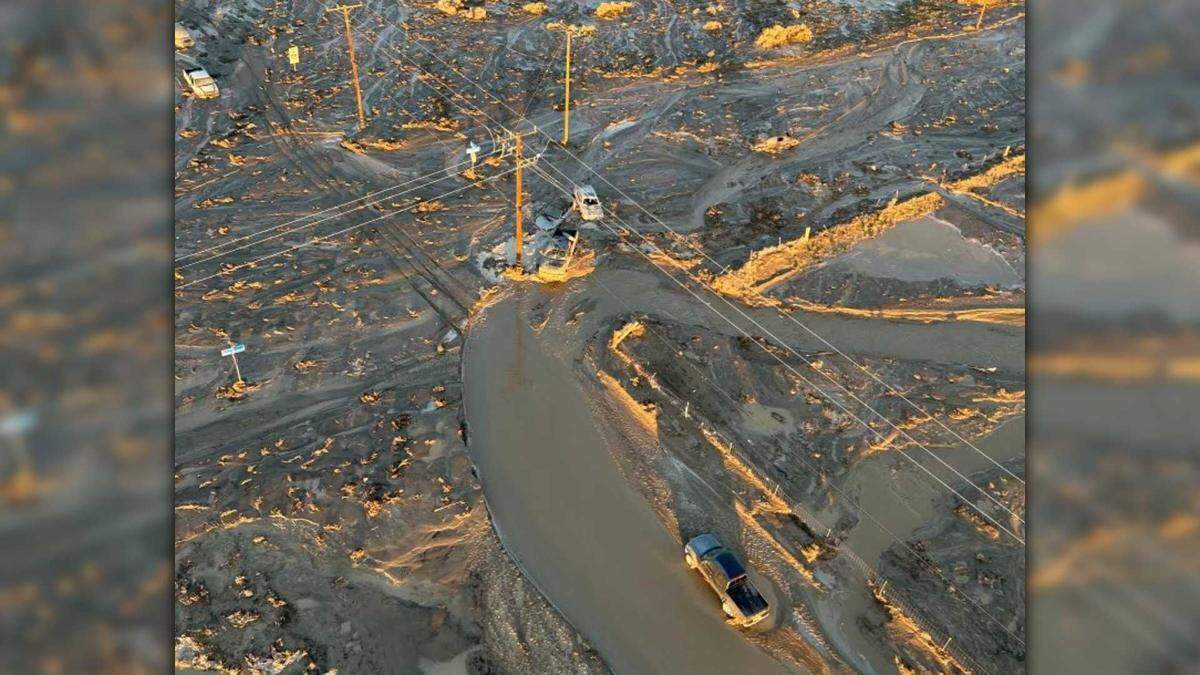 Multiple vehicles sit stranded on a washed-out road on Thursday, Dec. 25, 2025, in the high desert of San Bernardino County, in a photo released by the Los Angeles County Fire Department. Gov. Gavin Newsom declared a state of emergency for six California counties after days of storms triggered flooding, landslides and power outages and contributed to at least three deaths statewide.