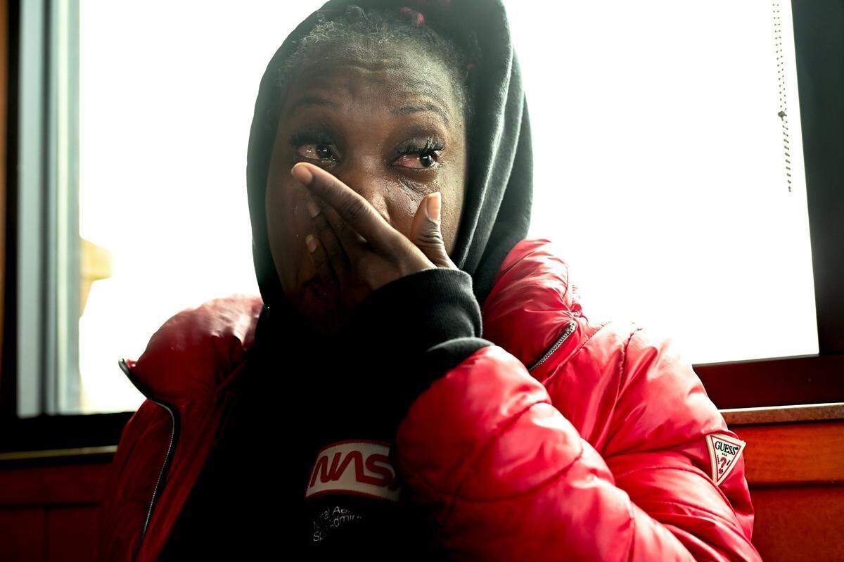 Brittany Anderson, 36, who said she is suffering from postpartum depression, cries inside a Taco Bell restaurant where the homeless mother was waiting to pick up her 4-year-old son from school in February. She had been evicted from The Greens Hotel, a city-run shelter, along with her 5-month-old baby. She said she had wandered around Elk Grove all night trying not to freeze.