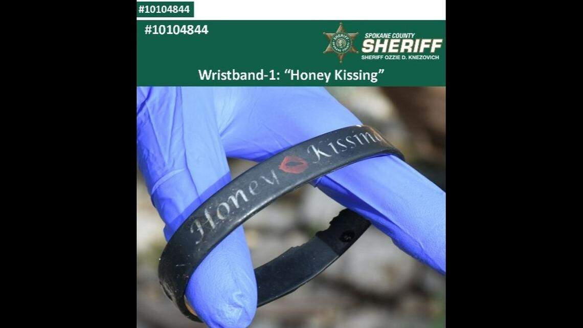 A wrist band found that says “Honey Kissing”.