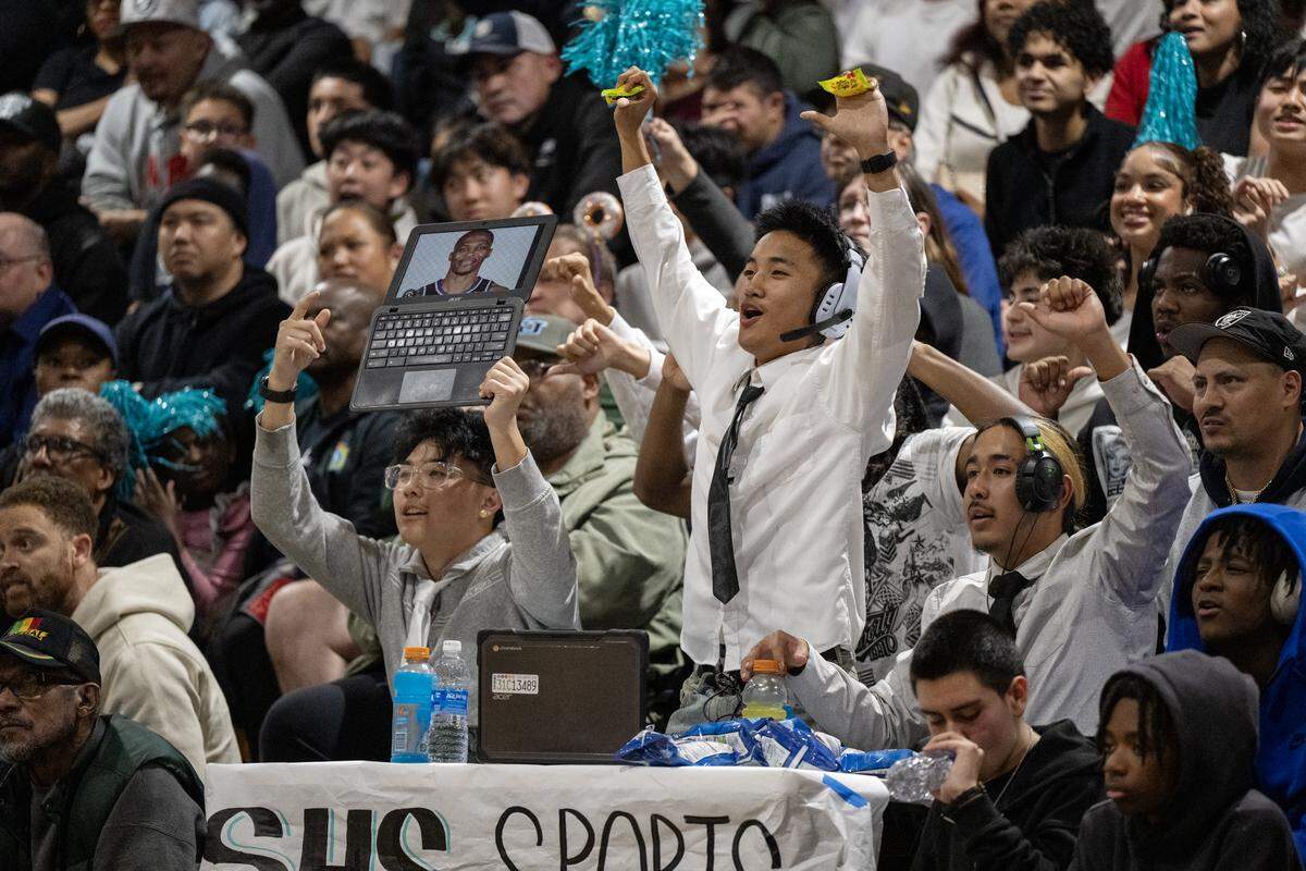 The Sheldon Huskies’ student section tries to distract a Folsom Bulldogs player as he shoots free throws in the second half of a CIF Sac-Joaquin Section Division I semifinal game Tuesday in Vineyard.
