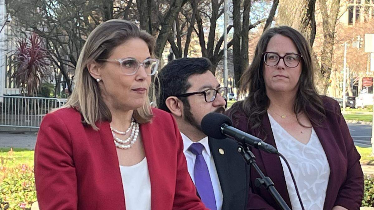 Assemblymember Maggy Krell, D-Sacramento, discusses a lawsuit demanding federal compliance with two Freedom of Information Act requests she filed regarding federal immigration enforcement activity at Sacramento’s John Moss Federal Building. With Krell at a news conference on Thursday are Sacramento Councilman Eric Guerra and Jessie Mabrey, CEO of the refugee and immigrant rights group Opening Doors.