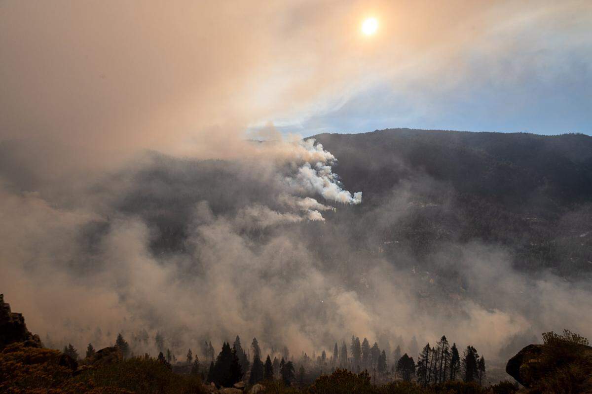 The Caldor Fire burns along the eastern side of Christmas Valley on Tuesday, Aug. 31, 2021, in El Dorado County. The fire jumped Highway 89 late Monday near Christmas Valley, approaching a cluster of homes and cabins straddling Highway 89 just east of the summit and about two miles south of Meyers.