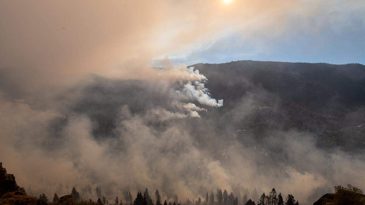 The Caldor Fire burns along the eastern side of Christmas Valley on Tuesday, Aug. 31, 2021, in El Dorado County. The fire jumped Highway 89 late Monday near Christmas Valley, hitting a cluster of homes and cabins between highways 50 and 89 just east of the summit and about two miles south of Meyers.
