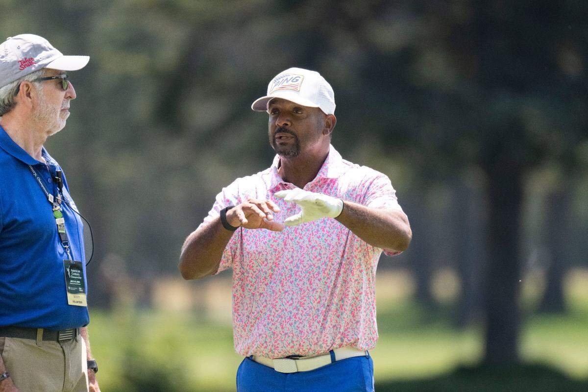 Actor Alfonso Ribeiro chats with a volunteer during the final day of the American Century Championship celebrity golf tournament at Edgewood Tahoe Resort in Stateline, Nev., on Sunday, July 13, 2025.