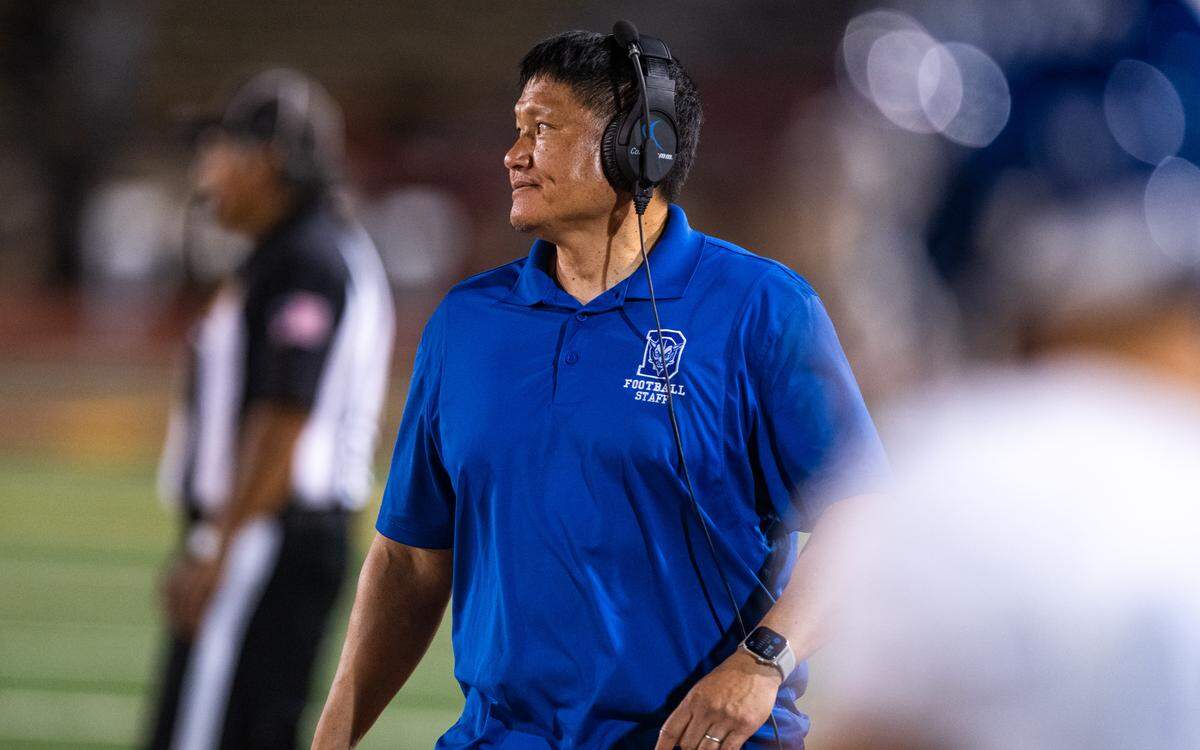 Davis coach Roscoe Ahn looks to the field against the McClatchy Lions on Friday at Hughes Stadium in Sacramento. 