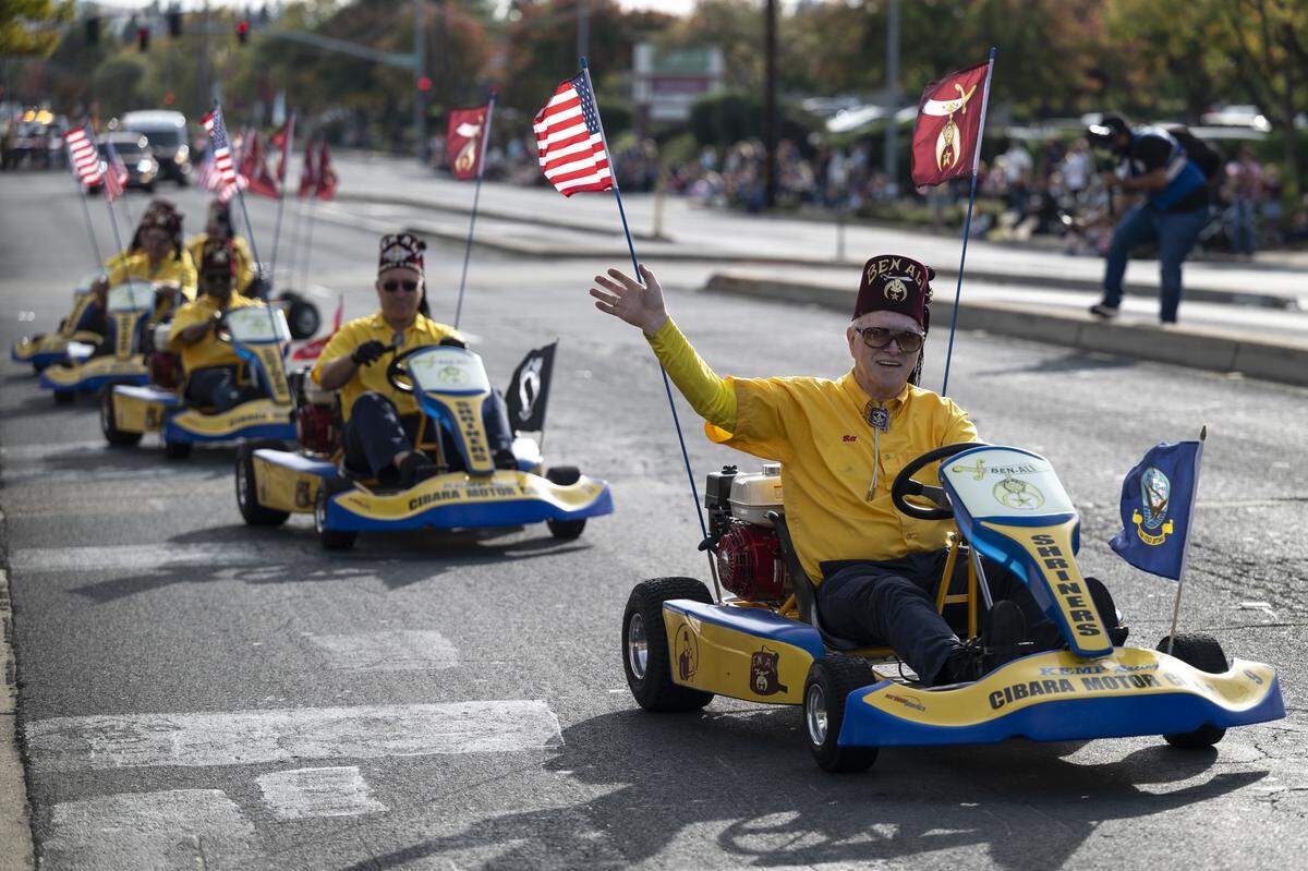 Ben-Ali Shriners ride go-karts during a Veterans Day parade in Folsom on Tuesday, Nov. 11, 2025.