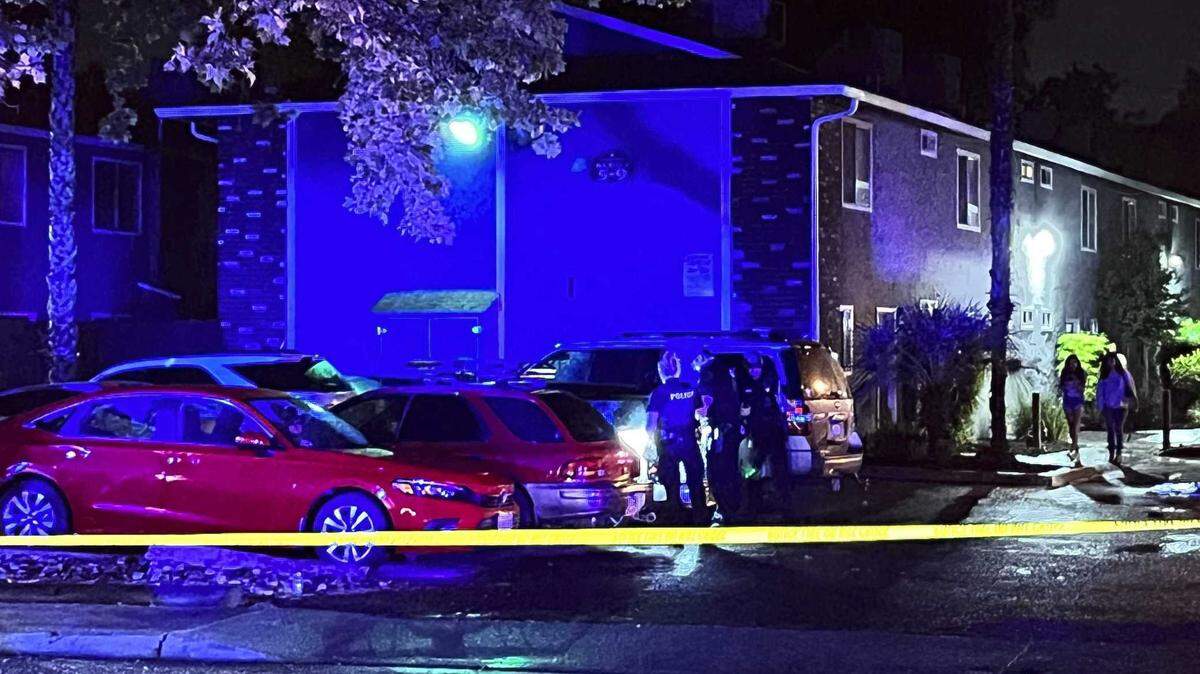 Police investigate an incident on Columbus Avenue connected to a house party thrown in an apartment complex after midnight, Saturday in Chico, California. Officials say officers responding to a call around 3:30 a.m. found six gunshot victims, one of whom was killed.